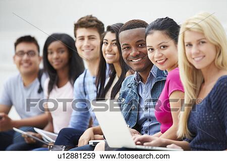 Stock Photo - Portrait Of University Students Outdoors On Campus. Fotosearch