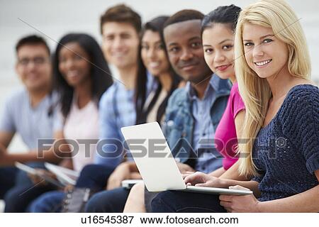 Stock Photo - Portrait Of University Students Outdoors On Campus. Fotosearch