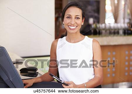 Portrait Of Waitress In Hotel Restaurant Preparing Bill View Large Photo Image Picture - Portrait Of Waitress In Hotel Restaurant Preparing Bill . Fotosearch