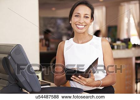 Portrait Of Waitress In Hotel Restaurant Preparing Bill View Large Photo Image Stock Photo - Portrait Of Waitress In Hotel Restaurant Preparing Bill . Fotosearch