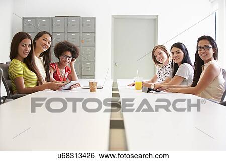 Stock Photograph - Portrait Of Women Working Together In Design Studio. Fotosearch