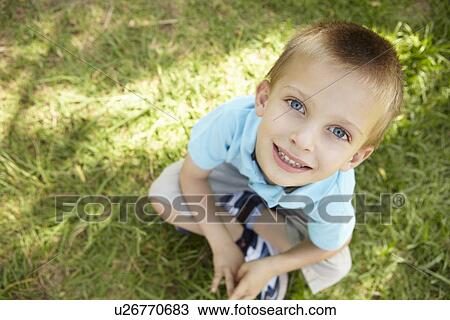 Stock Image - Portrait of young boy outdoors. Fotosearch