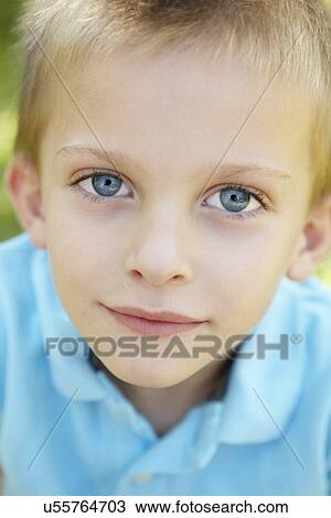 Stock Image - Portrait of young boy outdoors. Fotosearch