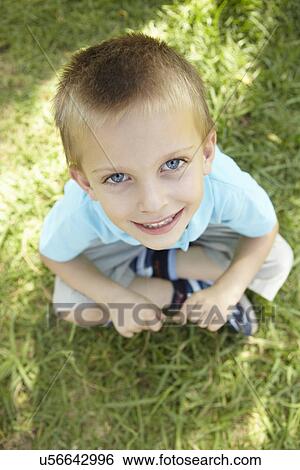 Portrait of young boy outdoors View Large Photo Image Stock Photograph - Portrait of young boy outdoors. Fotosearch