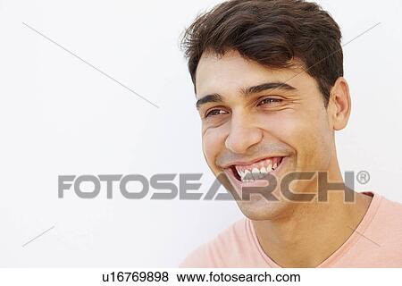 Portrait Of Young Man Standing By Wall View Large Photo Image Stock Photo - Portrait Of Young Man Standing By Wall. Fotosearch