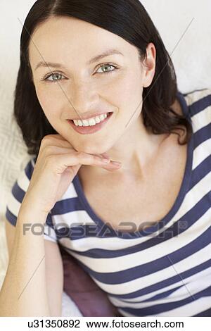 Stock Image - Portrait woman indoors. Fotosearch