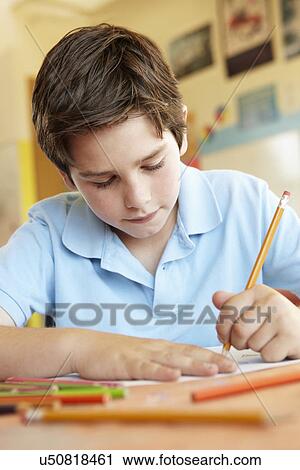 Pre teen boy in art class View Large Photo Image Stock Image - Pre teen boy in art class. Fotosearch