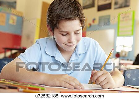 Pre teen boy in art class View Large Photo Image Stock Photography - Pre teen boy in art class. Fotosearch