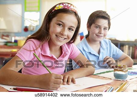Stock Image - Pre teen children in art class. Fotosearch