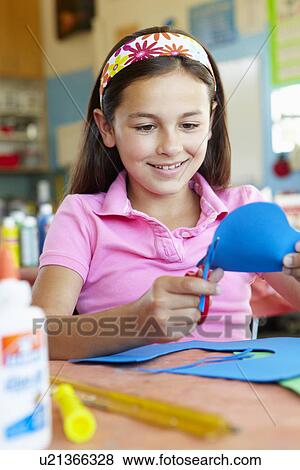 Stock Photo - Pre teen girl in art and craft class. Fotosearch