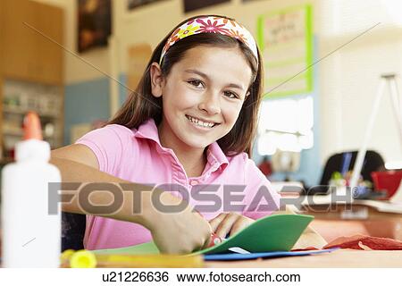 Stock Photograph - Pre teen girl in art and craft class. Fotosearch
