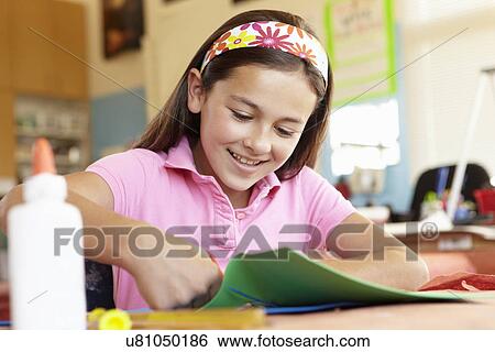 Stock Photograph - Pre teen girl in art and craft class. Fotosearch