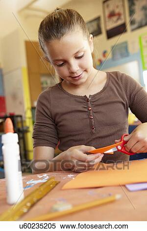 Stock Photography - Pre teen girl in art and craft class. Fotosearch