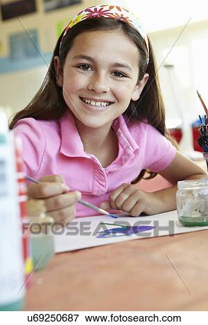 Stock Photo - Pre teen girl in art class. Fotosearch
