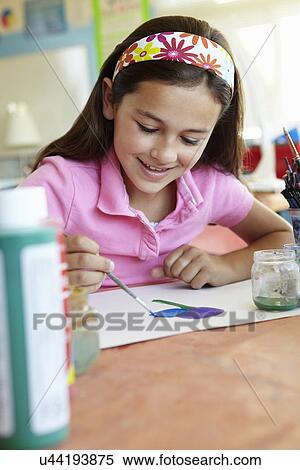 Stock Photography - Pre teen girl in art class. Fotosearch