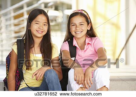 Stock Image - Pre teen girls in school. Fotosearch
