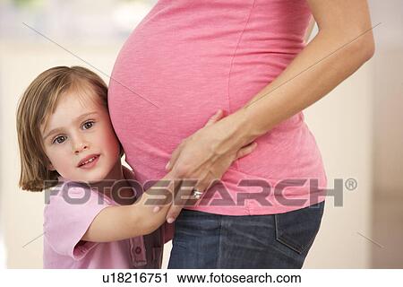 Pregnant woman with daughter View Large Photo Image Stock Image - Pregnant woman with daughter. Fotosearch