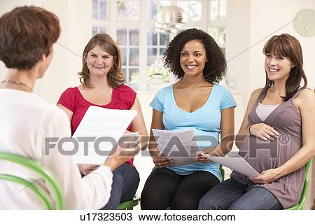 Stock Image - Pregnant women at ante natal class. Fotosearch