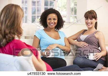 Pregnant women relaxing together View Large Photo Image Stock Image - Pregnant women relaxing together. Fotosearch