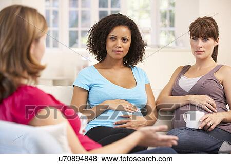 Pregnant women relaxing together View Large Photo Image Stock Photo - Pregnant women relaxing together. Fotosearch