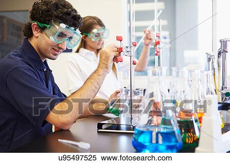 Pupils Carrying Out Experiment In Science Class View Large Photo Image Stock Photography - Pupils Carrying Out Experiment In Science Class. Fotosearch