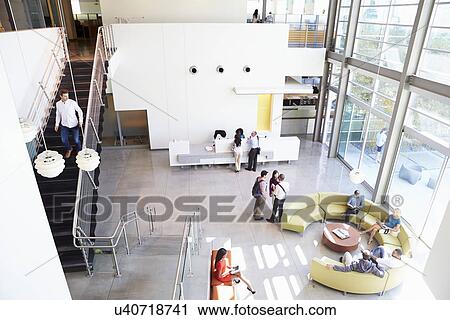 Reception Area Of Modern Office Building With People View Large Photo Image Stock Image - Reception Area Of Modern Office Building With People. Fotosearch