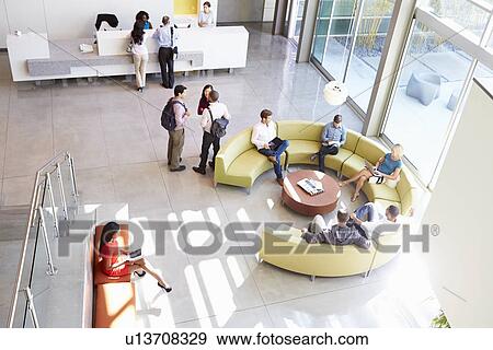 Reception Area Of Modern Office Building With People View Large Photo Image Stock Photo - Reception Area Of Modern Office Building With People. Fotosearch