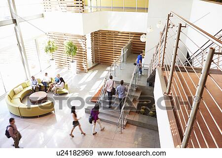 Reception Area Of Modern Office Building With People View Large Photo Image Stock Photo - Reception Area Of Modern Office Building With People. Fotosearch