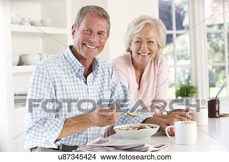 Retired couple eating breakfast View Large Photo Image Picture - Retired couple eating breakfast. Fotosearch