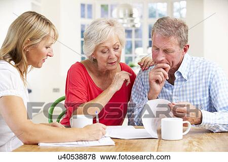 Retired couple with financial advisor View Large Photo Image Stock Photo - Retired couple with financial advisor. Fotosearch