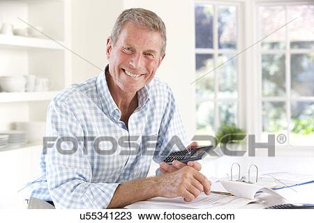 Retired man with household bills View Large Photo Image Stock Image - Retired man with household bills. Fotosearch