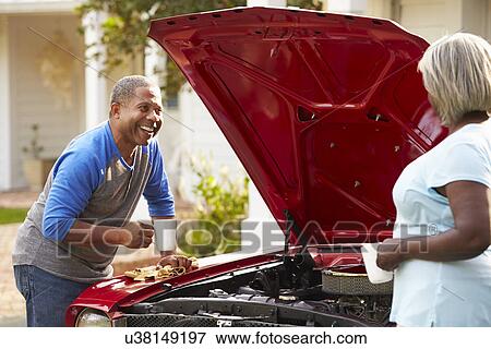 Retired Senior Couple Working On Restored Car View Large Photo Image Stock Photo - Retired Senior Couple Working On Restored Car . Fotosearch