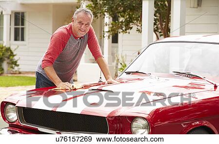 Retired Senior Man Cleaning Restored Classic Car View Large Photo Image Stock Photo - Retired Senior Man Cleaning Restored Classic Car. Fotosearch