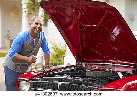 Retired Senior Man Working On Restored Car View Large Photo Image Stock Photo - Retired Senior Man Working On Restored Car . Fotosearch