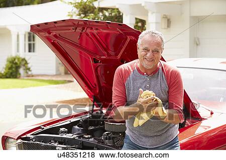 Retired Senior Man Working On Restored Classic Car View Large Photo Image Stock Photo - Retired Senior Man Working On Restored Classic Car. Fotosearch
