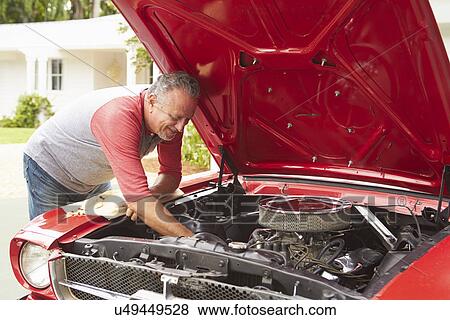 Retired Senior Man Working On Restored Classic Car View Large Photo Image Stock Photo - Retired Senior Man Working On Restored Classic Car. Fotosearch