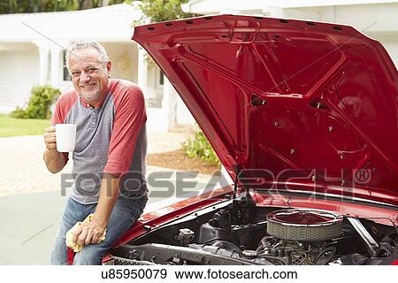 Retired Senior Man Working On Restored Classic Car View Large Photo Image Stock Photo - Retired Senior Man Working On Restored Classic Car. Fotosearch
