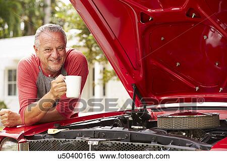 Retired Senior Man Working On Restored Classic Car View Large Photo Image Stock Photography - Retired Senior Man Working On Restored Classic Car. Fotosearch