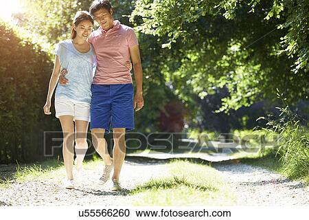 Romantic Asian Couple On Walk In Countryside View Large Photo Image Stock Image - Romantic Asian Couple On Walk In Countryside. Fotosearch