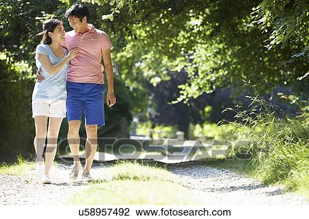 Romantic Asian Couple On Walk In Countryside View Large Photo Image Stock Image - Romantic Asian Couple On Walk In Countryside. Fotosearch