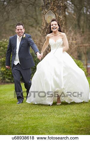Stock Photo - Romantic Bride And Groom On Wedding Day. Fotosearch