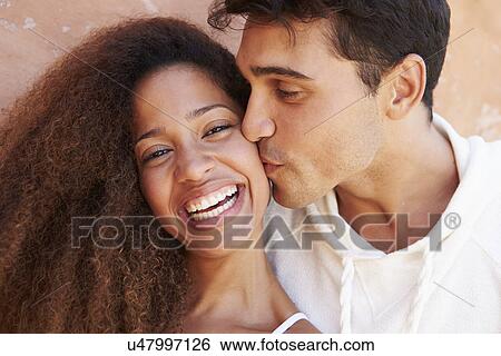 Romantic Couple On Holiday Together Posing By Wall View Large Photo Image Stock Photograph - Romantic Couple On Holiday Together Posing By Wall. Fotosearch