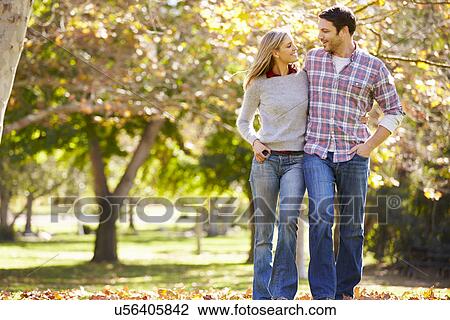 Romantic Couple Walking Through Autumn Woodland View Large Photo Image Stock Image - Romantic Couple Walking Through Autumn Woodland. Fotosearch