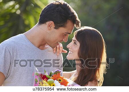 Romantic Man Giving Woman Bunch Of Flowers View Large Photo Image Picture - Romantic Man Giving Woman Bunch Of Flowers. Fotosearch