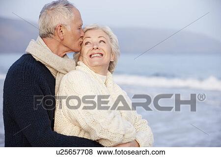 Stock Photo - Romantic Senior Couple On Winter Beach. Fotosearch