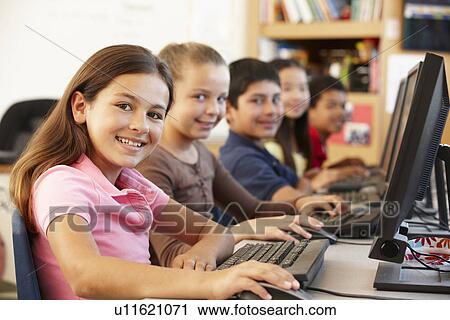 Stock Image - Schoolchildren working on computers. Fotosearch