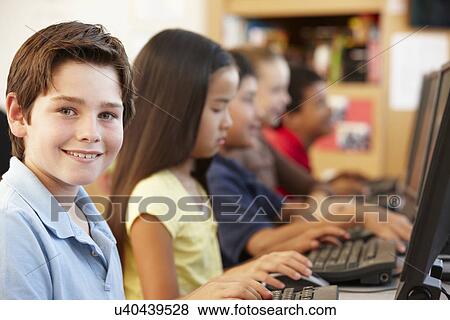 Schoolchildren working on computers View Large Photo Image Stock Photo - Schoolchildren working on computers. Fotosearch