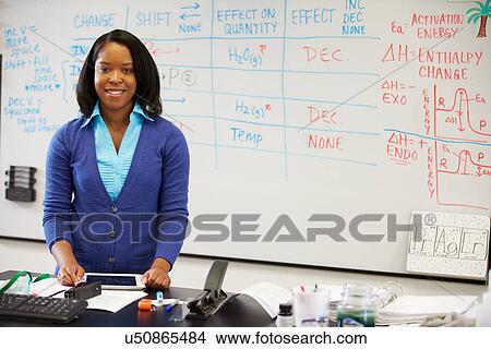 Picture - Science Teacher Standing At Whiteboard With Digital Tablet. Fotosearch