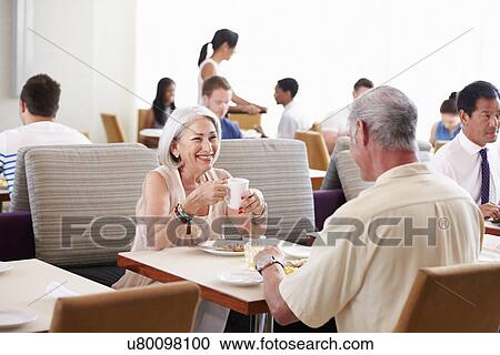 Senior Couple Enjoying Breakfast In Hotel Restaurant View Large Photo Image Stock Image - Senior Couple Enjoying Breakfast In Hotel Restaurant. Fotosearch