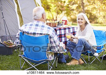 Senior Couple Enjoying Camping Holiday In Countryside View Large Photo Image Picture - Senior Couple Enjoying Camping Holiday In Countryside. Fotosearch